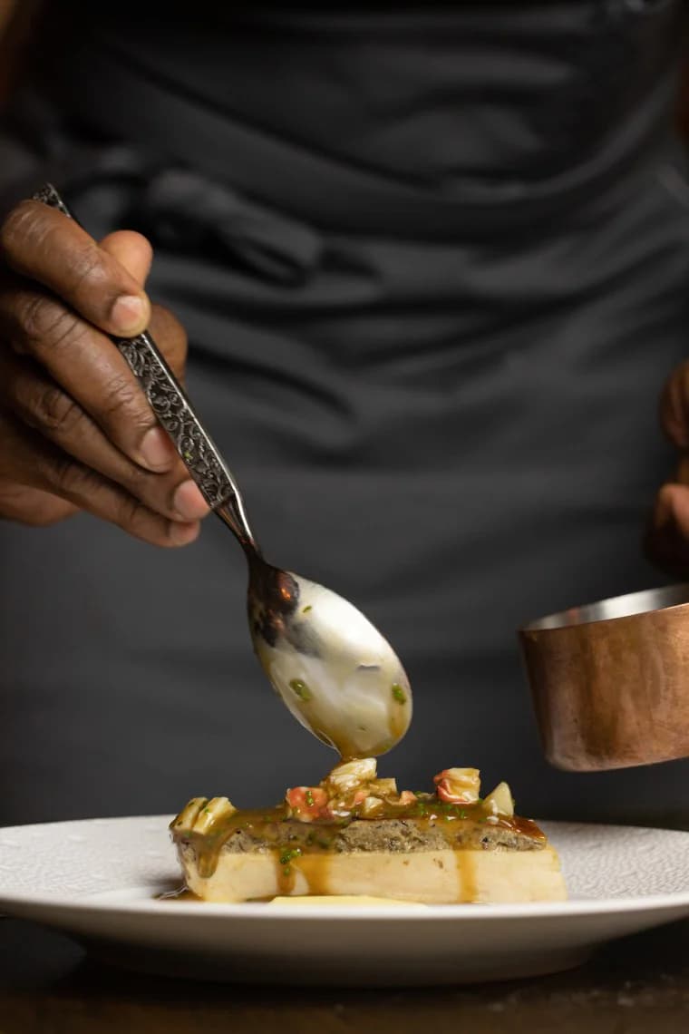 Chef Alrick Malcolm in a professional kitchen.